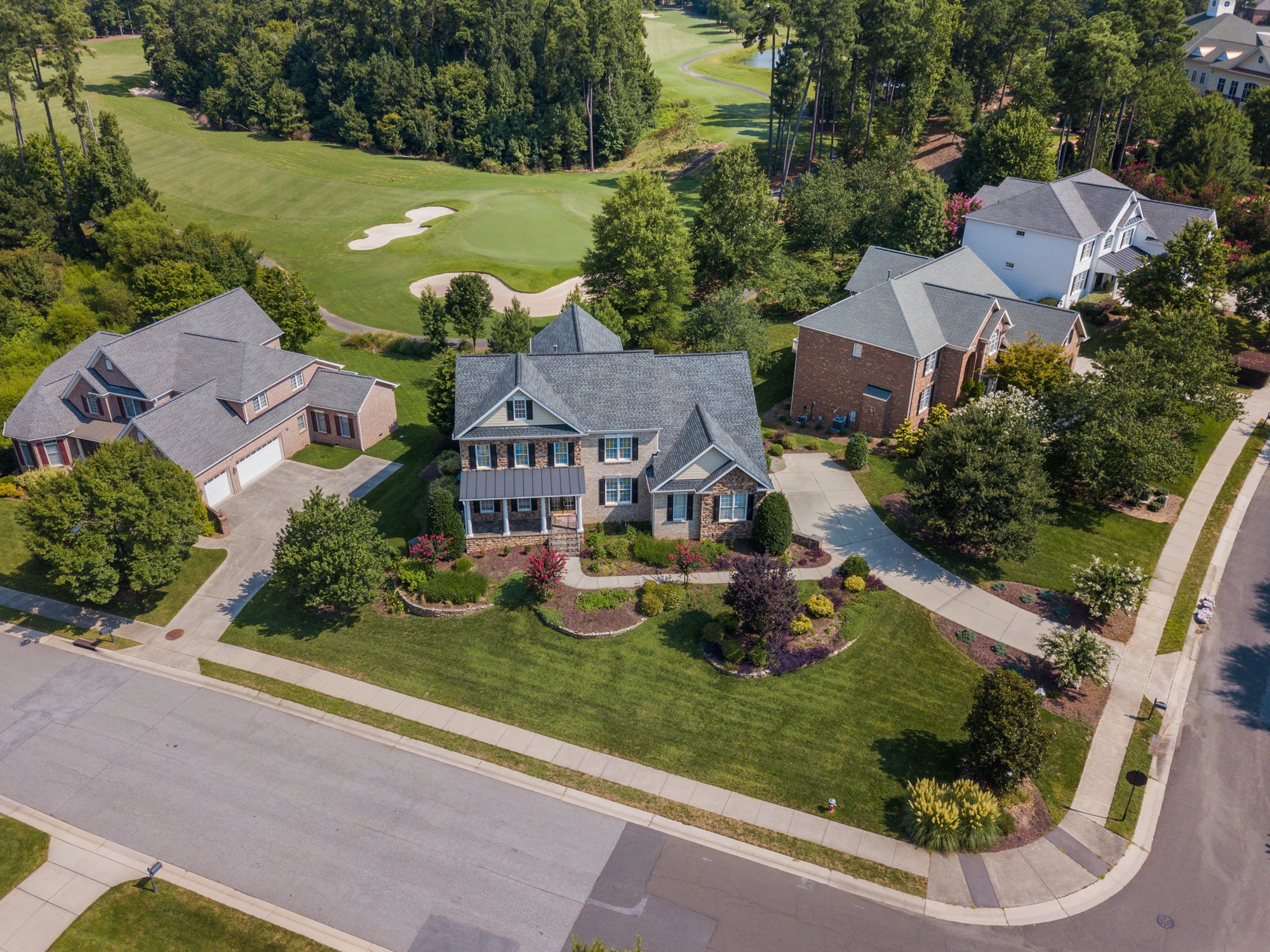 Pexel - aerial view houses with golfcourse at back